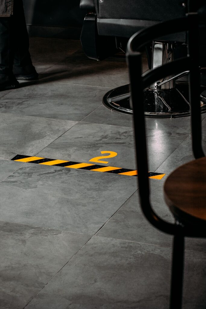 Photo by Amr Taha™ a yellow caution line on the floor of a restaurant